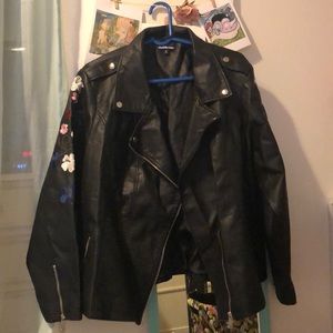 Black faux leather jacket with floral sew-in
